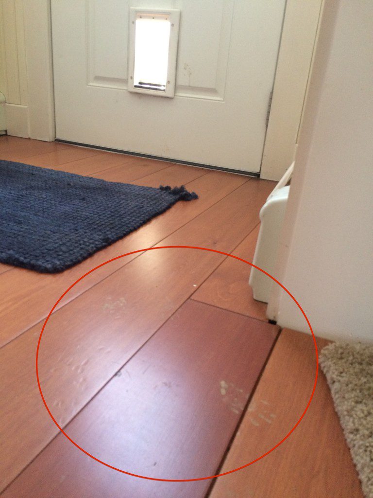 Floor scratches by door entrance