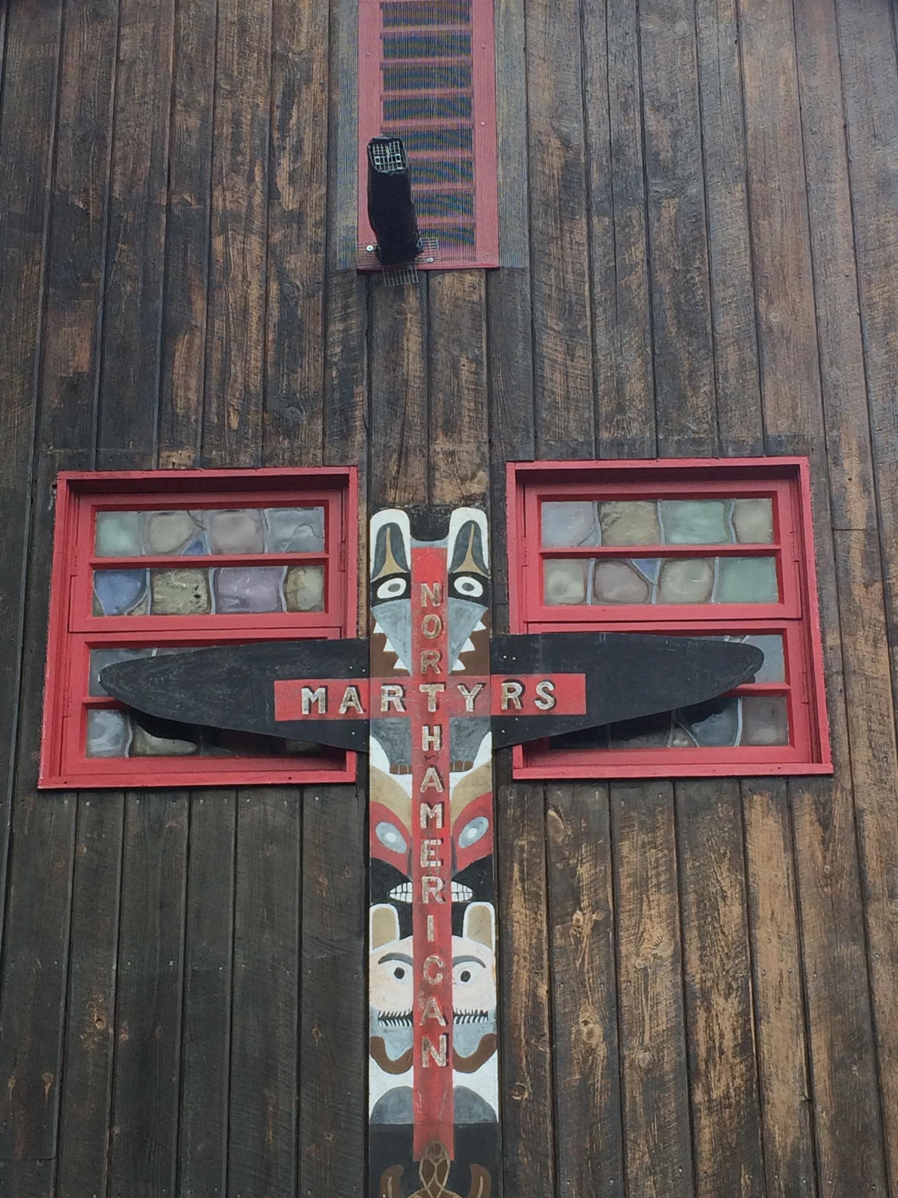 Wooden totem with red windows