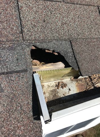 Roof hole exposing wooden structure