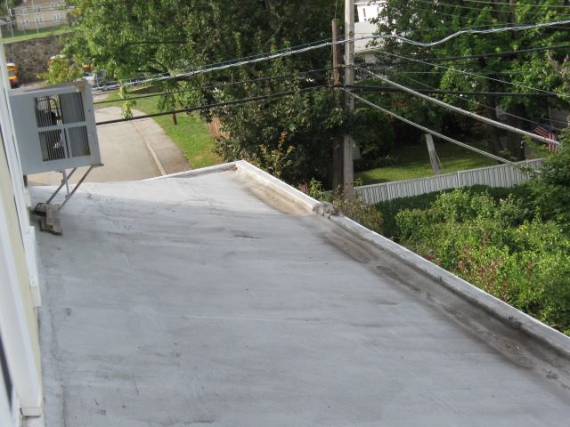 Rooftop view with trees and road