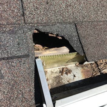 Roof hole exposing wooden structure