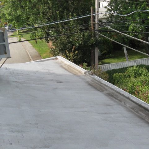 Rooftop view with trees and road